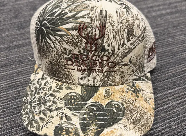 South Texas camo mesh Game Guard hat with WPP logo on the side